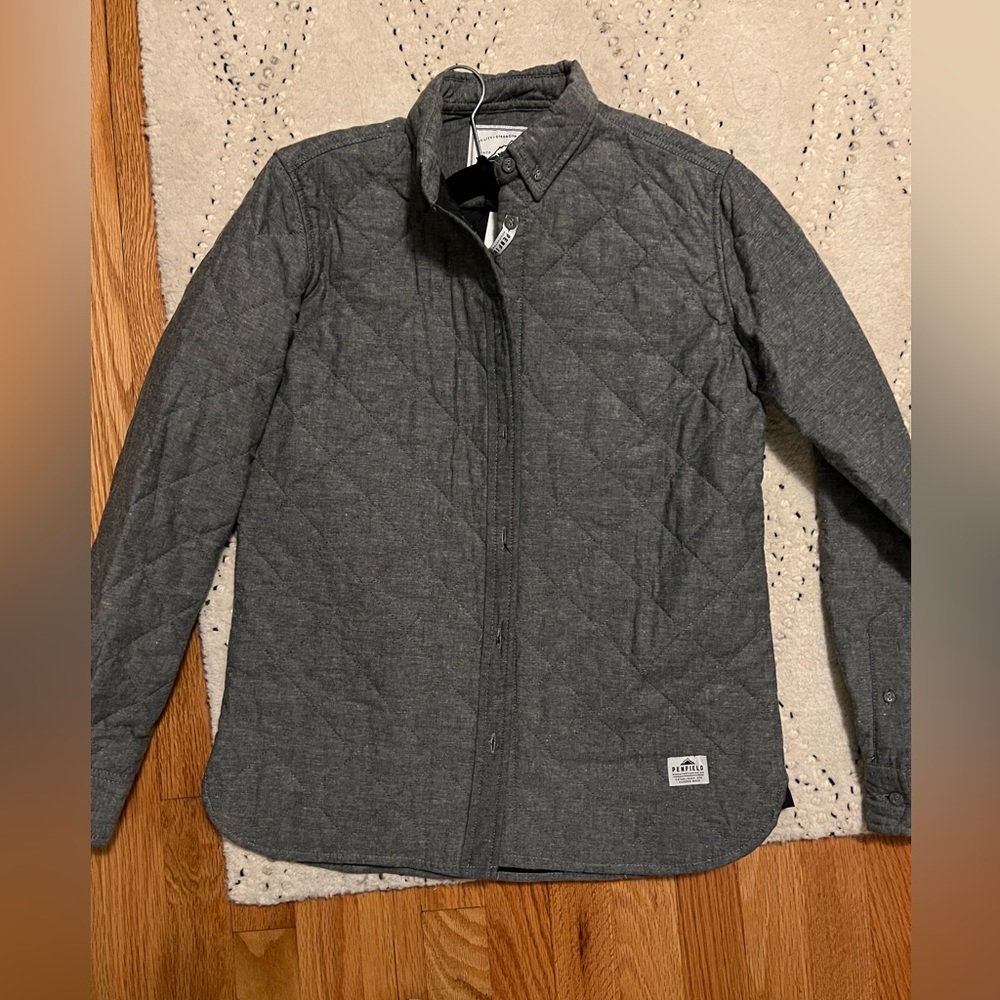 Brand new with tags, size M, women’s quilted puffer button down, chambray.